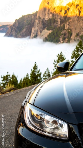 Black car in front of scenic road