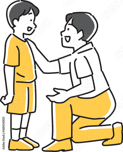 男の子を励ます男性