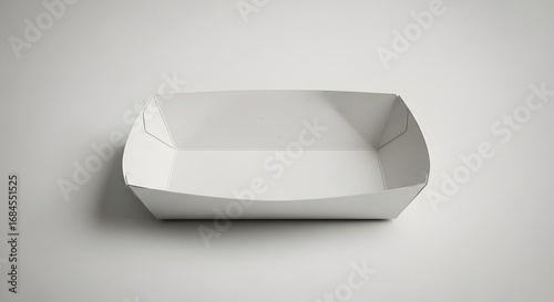 Empty white disposable cardboard food tray for snacks or fast food, isolated on a light background