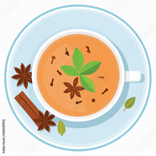 Overhead view of a cup of chai tea with spices like star anise, cloves, cinnamon, cardamom, and a green leaf garnish on a blue plate.