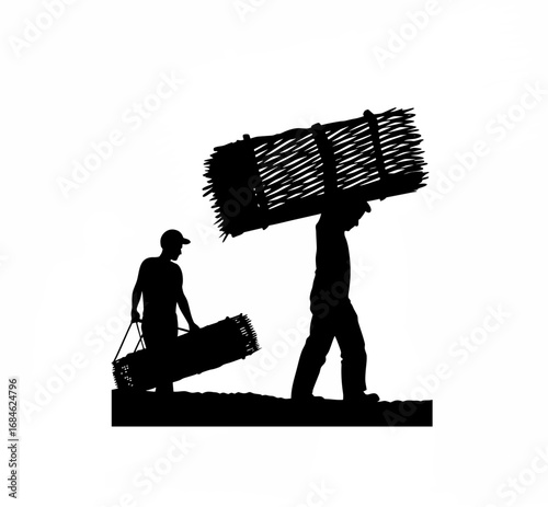 Silhouette of a factory worker transporting materials to a cnc machine