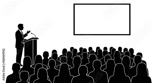 speaker addressing a large audience at a conference or presentation, with a blank screen for additional content
