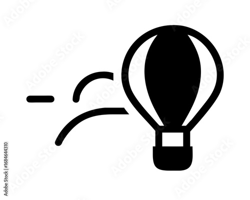 Black and white icon of a hot air balloon in motion