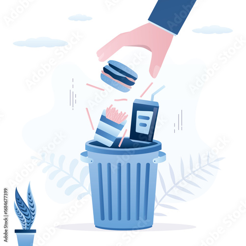 Human hand throwing unhealthy fast food into trash can. Healthy eating and weight loss concept. Proper nutrition. Refusal of sweet and unhealthy food. Stop eating junk food.