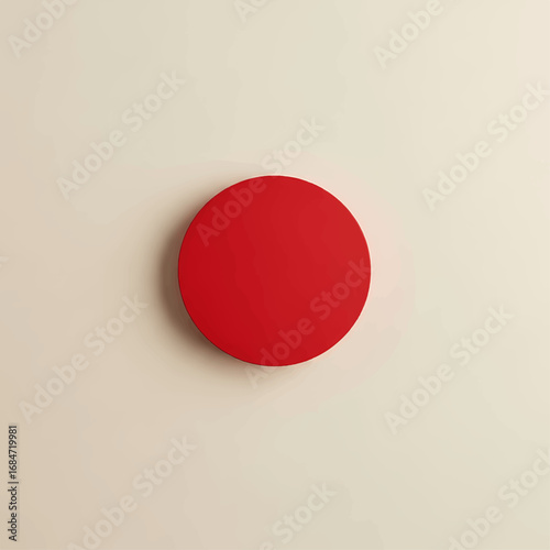 A striking red circular object casting a subtle shadow, representing concepts of focus, unity, and simplicity