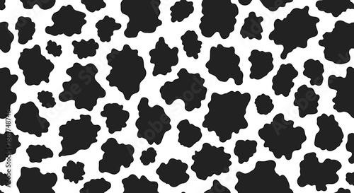 Black and white cow pattern background with irregular spots.