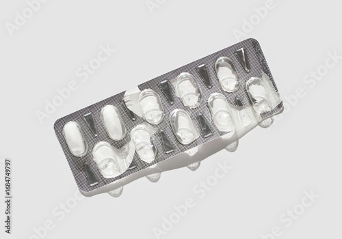 Obraz na plátně Empty blister pack with silver foil on white background highlighting medication absence