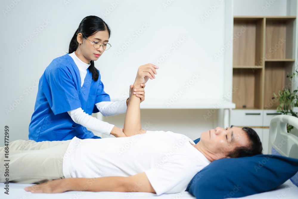 Fototapeta premium healthcare worker stretching patient’s arm in clinic. Ideal for physiotherapy, injury recovery, elder care, rehab therapy, and pain relief healthcare visuals.