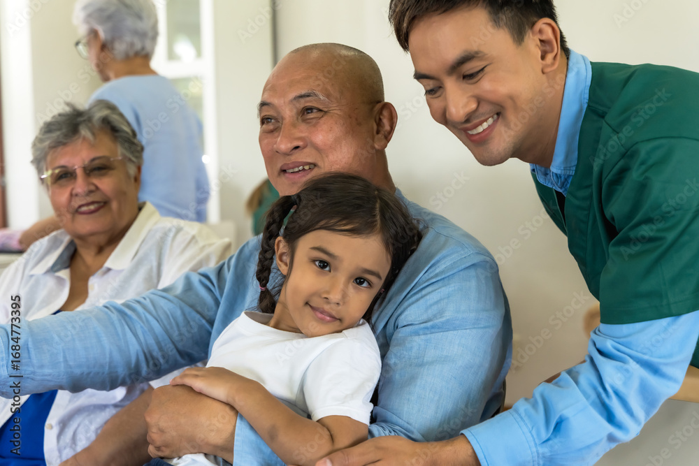 Obraz premium Grandpa and grandma feeling happy with young granddaughter visiting in senior homecare