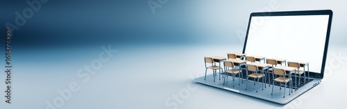 Online education concept with classroom desks on laptop keyboard on blue gradient background symbolizing digital learning and virtual teaching tools.