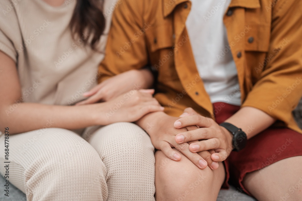 Fototapeta premium A lovely couple sharing a tender moment together, holding hands in an inviting, cozy atmosphere