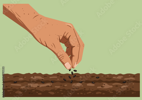 A hand scatters seeds on soil planting them in a prepared bed for growth