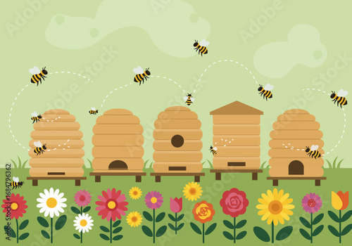 Bees fly near beehives amid blooming flowers in a green field