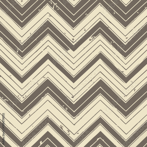 Abstract chevron pattern in muted tones with distressed texture. Seamless design with repeating zigzag shapes.