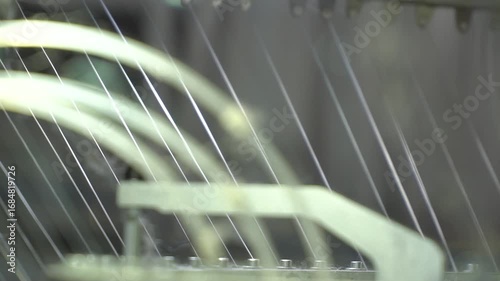 Textile fabric. Closeup yarns. Spinning Machine Textile Industry. close up spinning Machine. Yarn Spools