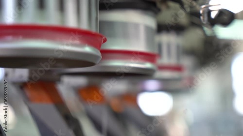 Textile fabric. Closeup yarns. Spinning Machine Textile Industry. close up spinning Machine. Yarn Spools