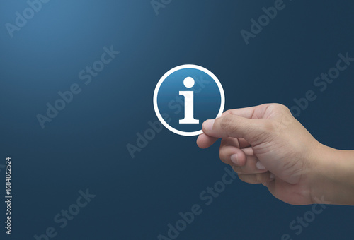 Hand holding information sign flat icon in fingers over light blue background, Business customer service and support concept
