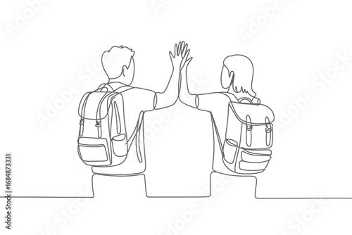 Two friends giving a high five while wearing backpacks