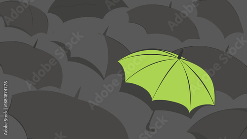 One bright green umbrella stands out among many dark umbrellas