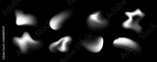 Blur shape blob collection with soft white gradient forms on black background for abstract design and overlay effects. Smooth organic modern elements with diffused blurry edges and glowing spots