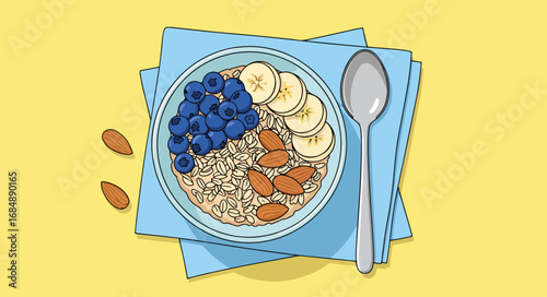 Delicious breakfast bowl with oatmeal, blueberries, banana, and nuts in flatlay composition presented from above. Breakfast bowl includes healthy ingredients such as oats, fresh berries,