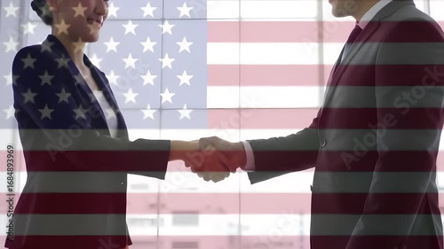 Business handshake against american flag backdrop in formal attire showing collaboration deal made