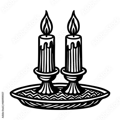 Two elegant candles burning brightly in a decorative holder, creating a warm and inviting glow