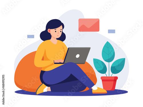 Woman working on laptop sitting comfortably on beanbag with plant and envelope nearby