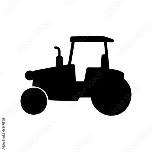 Black silhouette of a tractor driving in a farm field landscape