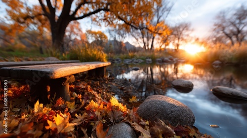 This tranquil autumn landscape features a scenic view of a reflective pond surrounded by beautifully colored leaves and a peaceful atmosphere, perfect for relaxation.