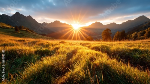 This stunning landscape shows a golden sunrise illuminating a serene mountain range and lush green fields, signifying hope, peace, and the beauty of nature’s canvas.