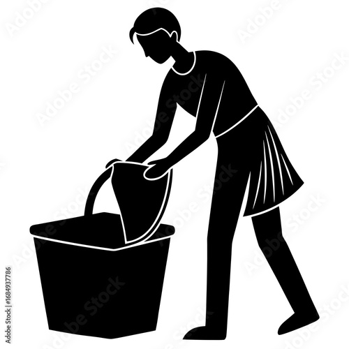 Person placing clothes in laundry basket black