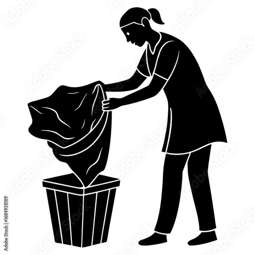 Person sorting laundry into bin black