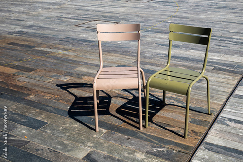 Fotografie Two old empty chairs seem to be talking to each other.