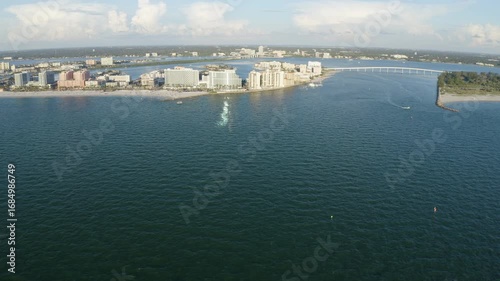 Wallpaper Mural Broad aerial view captures Clearwater Beach’s hotel skyline, sandy shoreline, and sweeping gulf waters with the bay bridge stretching across the horizon, conveying scale and coastal energy. Torontodigital.ca