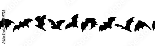 Seamless Halloween bat border on white background. Perfect for spooky headers, invitations, websites, and holiday designs featuring black flying vampire bats for horror night themes