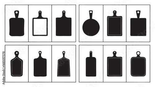 Various black cutting boards and a frying pan kitchenware