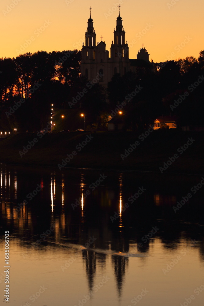 Fototapeta premium Incredible mysterious view of Saint Sophia Cathedral in Polotsk against the backdrop of the sunset sky
