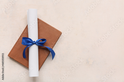 Diploma with blue ribbon an...