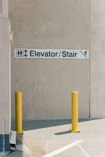 Sign to stairway entrance in parking deck.