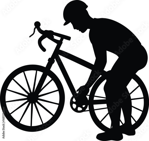 A black silhouette of a cyclist wearing a helmet, crouching to adjust the chain on their road bike.