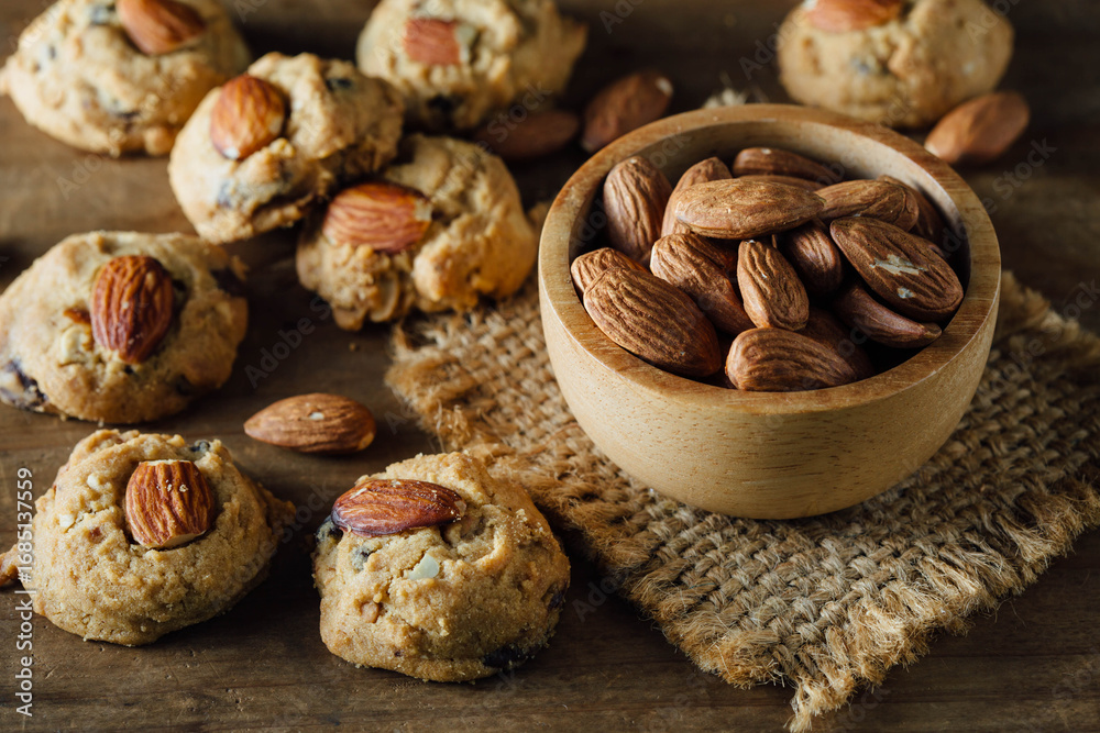 Fototapeta premium Delicious Cookies with Almonds on Rustic Wooden Background