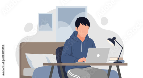 Young man working remotely on laptop from his cozy home office or studying online. Ideal for remote work, education, or freelance concepts.
