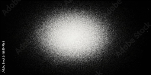 Abstract dark metal texture with a spotlight, featuring a brushed gray steel pattern on a metallic surface
