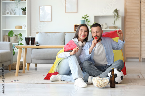 Young couple with flag of S...