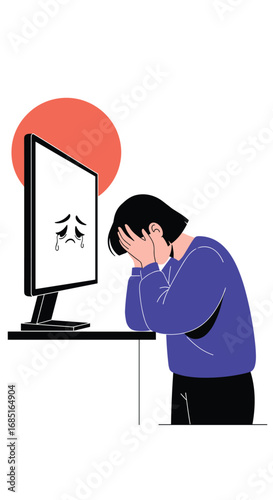 Young person feeling sad and stressed while looking at a computer screen with a frowning face
