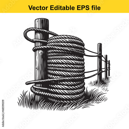 Coiled rope secured to a wooden post and fence in a grassy field