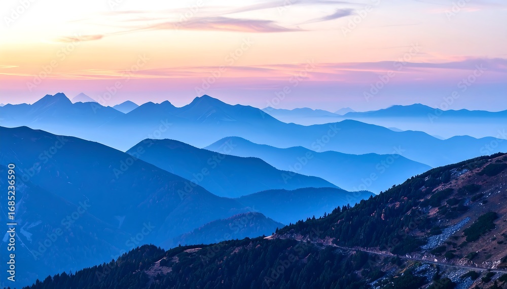 Obraz premium Panoramic view of mountain ranges at sunrise