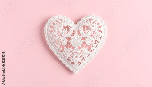White lacy heart on a pink background