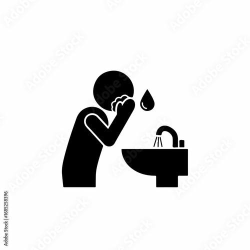 Solid glyph icon of a person cleaning their face at a basin.